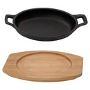 REGENT COOKWARE CAST IRON OVAL PAN WITH 2 HANDLES ON A WOODEN BOARD, (225X120X55MM)